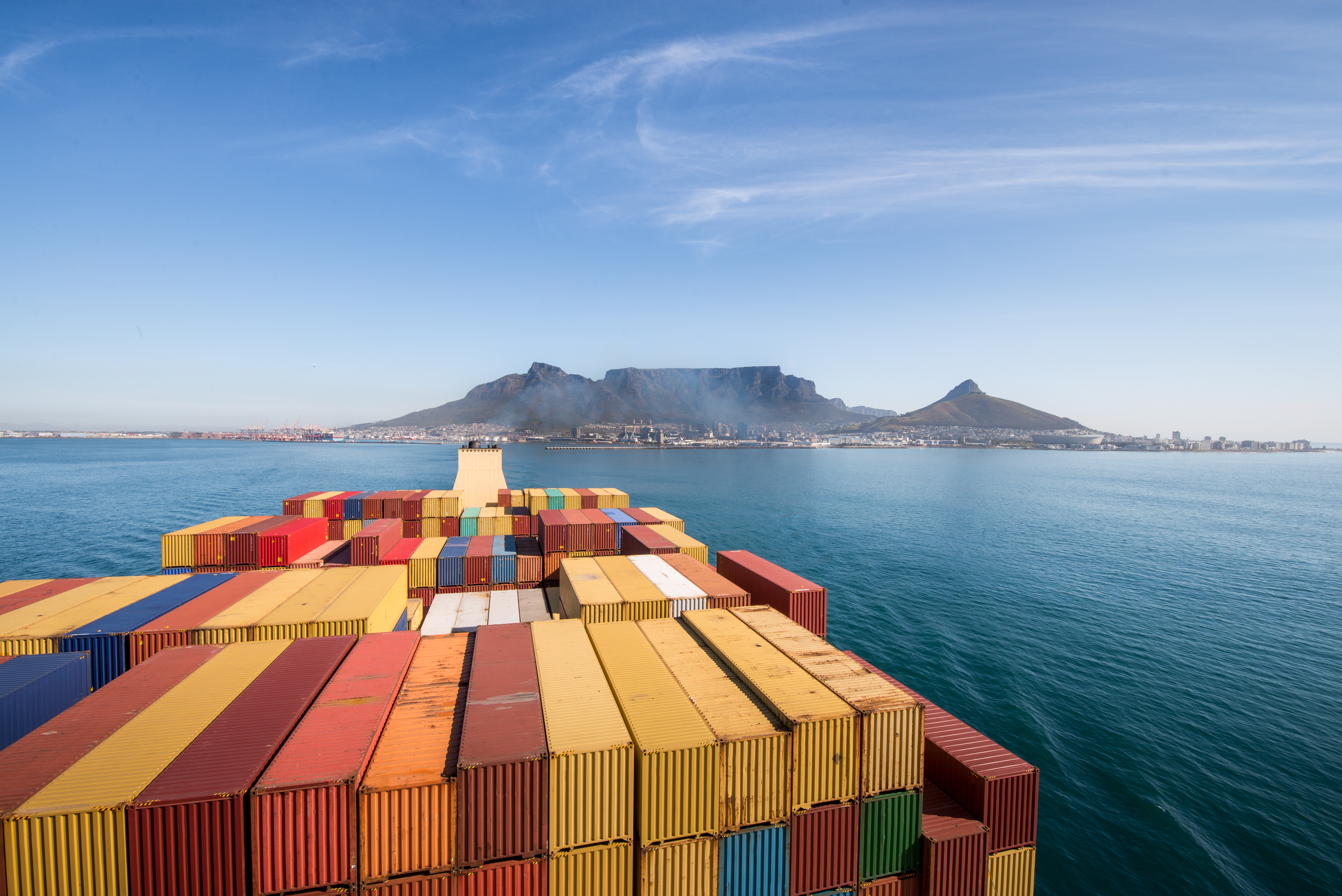 Aerial view of a busy shipping port with cargo containers